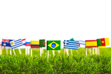 Paper cut of flags on grass for Soccer championship 2014