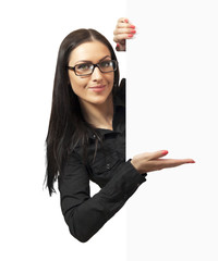Beautiful woman with glasses holding a blank billboard