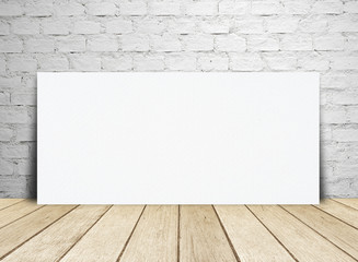 Blank paper poster and brick wall.