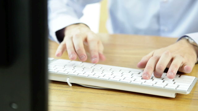 business man typing on the computer keyboard