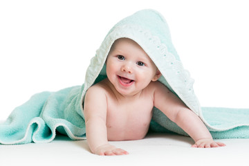 Funny baby boy in blue towel
