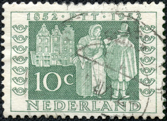 stamp shows Postman delivering letters, 1852