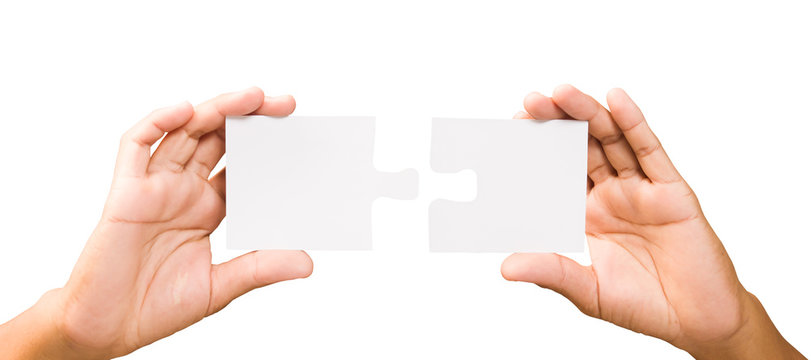 connection concept. hands with pieces of puzzle on white backgro