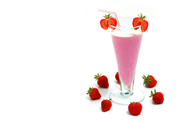 strawberry milkshake and fresh strawberries arranged in a circle