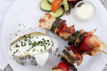 Chicken skewers with baked potato