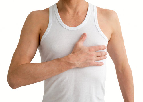 Man in white undershirt with hand on his heart