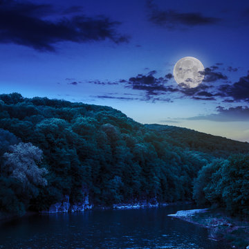 calm mountain river on a dark summer night