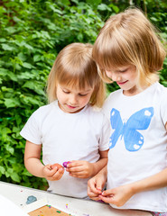 Children playing with plasticine