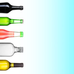 Collage of different alcohol bottles on blue background