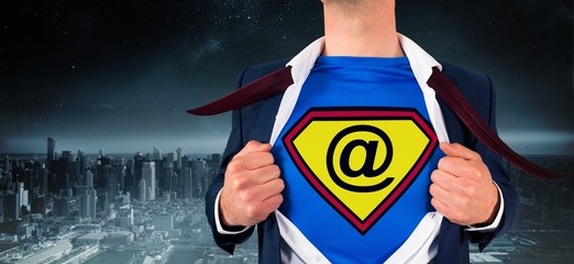 Composite image of businessman opening shirt in superhero style