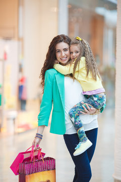 A young mother and her daughter, shopping