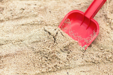 Fototapeta na wymiar Children's shovel in the sandbox.