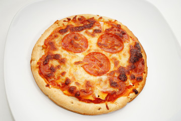 Personnal Size Pepperoni Pizza Served on a Plate