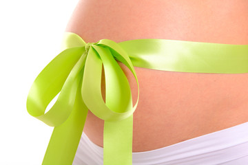 Pregnant belly with light green bow