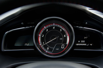 Close up of car dashboard and Odometer.