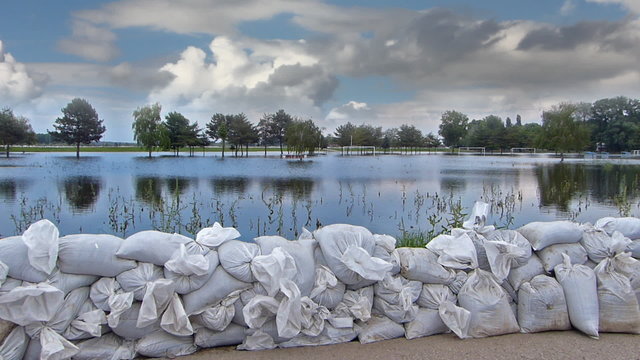 Defence of the flooded river, levee of sandbags