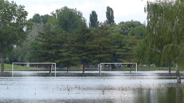 Flooded football field in town