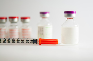 Disposable syringe and injection vials background