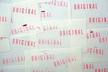 many stamped original on white papers