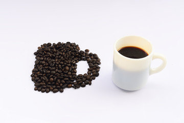 Cup of hot drink with coffee bean