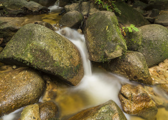 Fototapeta na wymiar Small waterfall in tropical rainforest