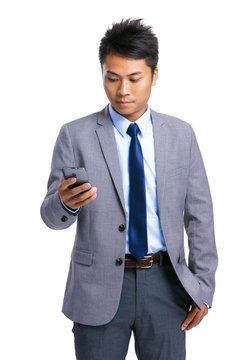 Asian businessman look at mobile