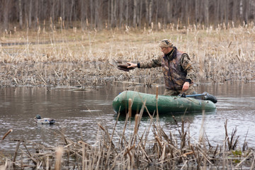 the hunter puts stuffed duck
