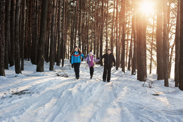 Fototapeta na wymiar happy family in winter forest