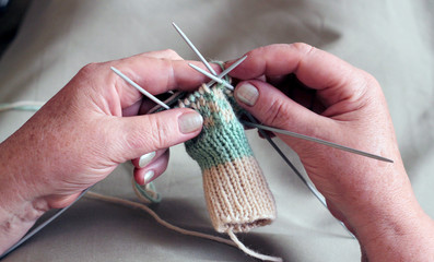 Hands of a woman knitting