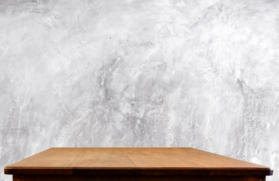 Concrete wall and wooden table