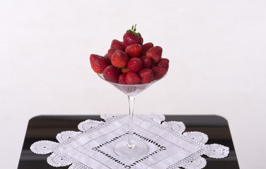 A glass of fresh English strawberries