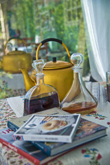 Fototapeta na wymiar Home-made liquer and old antique tea-pot