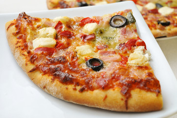pizza with bacon, olives, goat cheese and red pepper