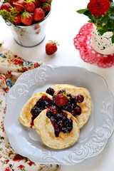Pancakes with berry topping with fresh berries