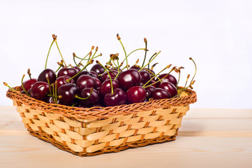 Fototapeta na wymiar sweet cherries in basket