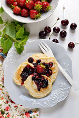 Pancakes with berry topping with fresh berries
