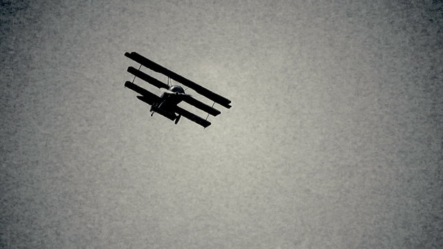 Retro tri-plane in flight black and white