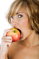 Attractive woman eating an apple 