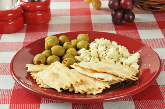 Flatbread crackers with feta cheese and olives