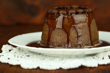Yummy chocolate cake on wooden background