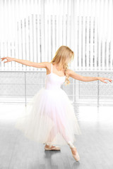 Beautiful balerina dancing in ballet class © Africa Studio