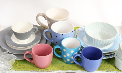 Different tableware on shelf, isolated on white