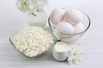 Tasty dairy products on wooden table