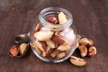 Tasty brasil nuts on wooden background
