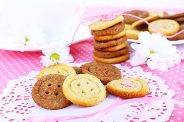 Sugar cookies in shape of buttons on table