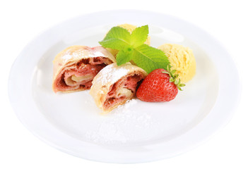 Tasty homemade strudel with ice-cream, fresh strawberry and