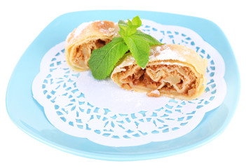 Tasty homemade strudel on plate isolated on white