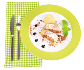 Tasty homemade apple strudel mint leaves and ice-cream
