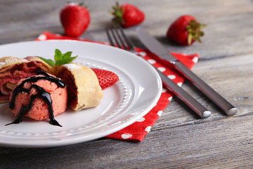 Tasty homemade strudel with ice-cream, fresh strawberry and