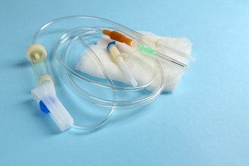 Disposable infusion set on blue background